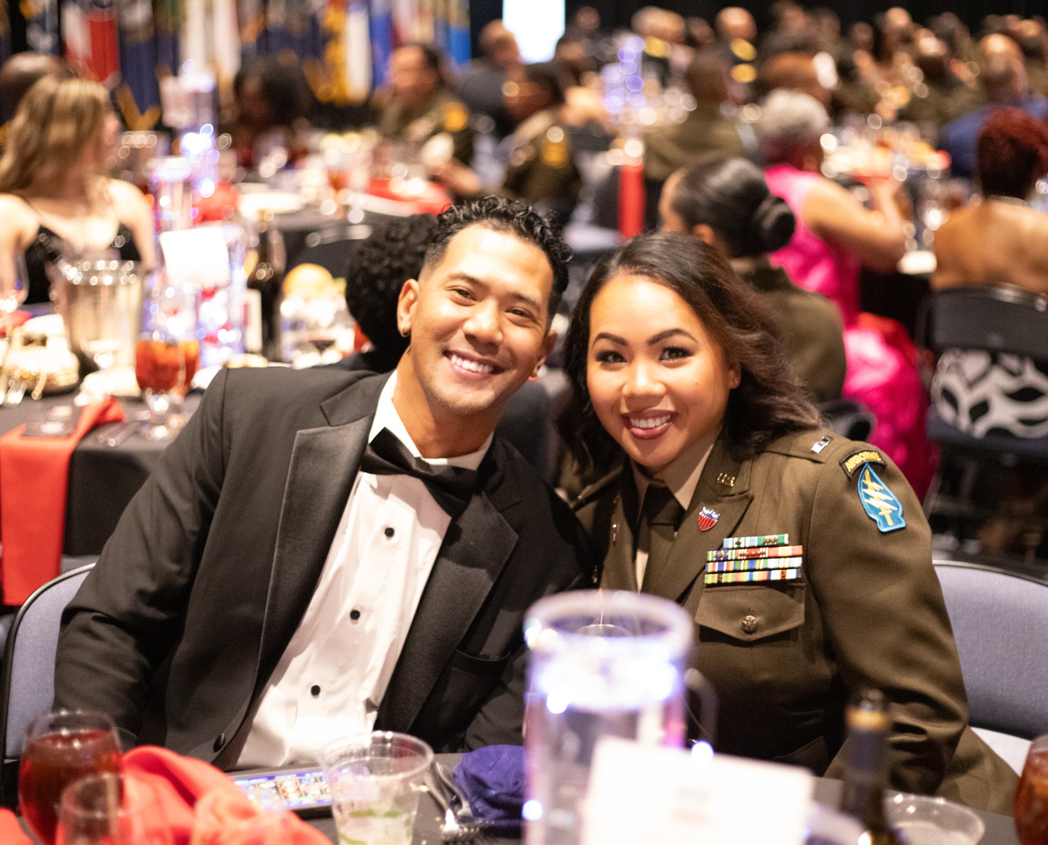Two guests seated together at a formal military event