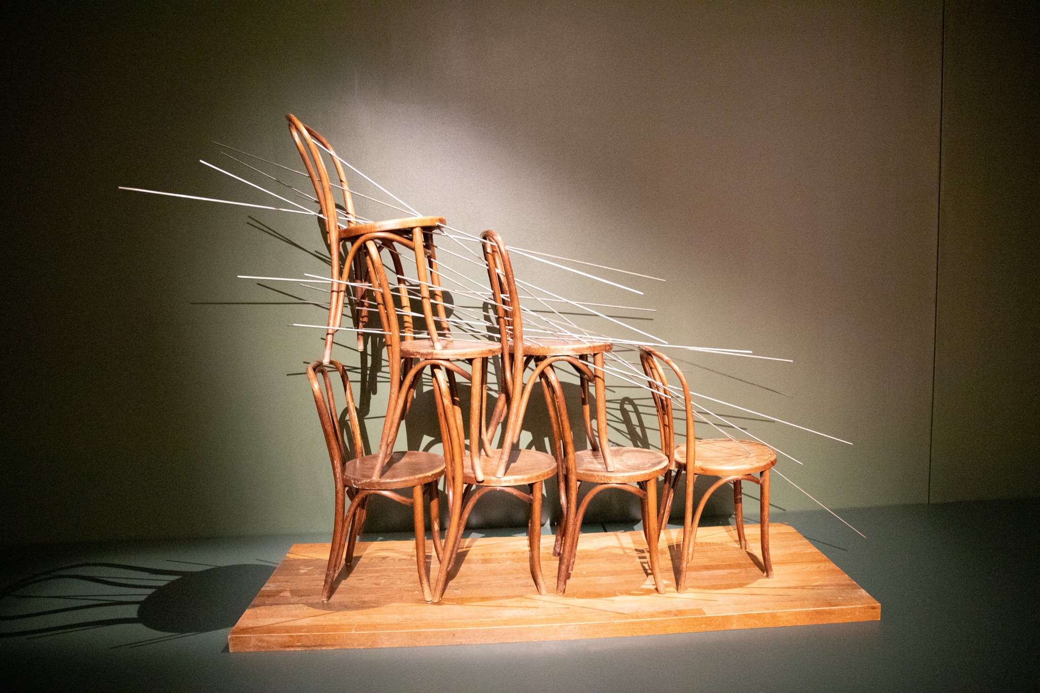 Sculptural installation of chairs in a gallery